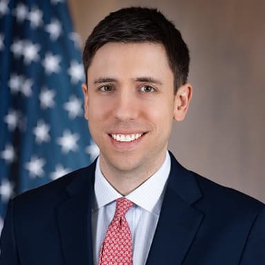 Official portrait of Travis Hill